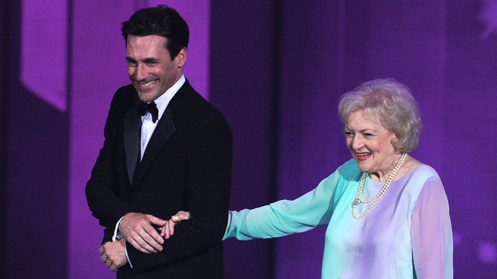 Actor Jon Hamm (L) and actress Betty White present the Outstanding Supporting Actor in a Comedy Series award onstage at the 62nd Annual Primetime Emmy Awards