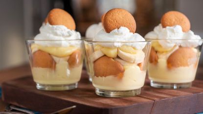 banana pudding cups with Nilla wafers and meringue on wooden table