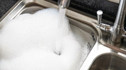 homemade all purpose cleaner in a kitchen sink