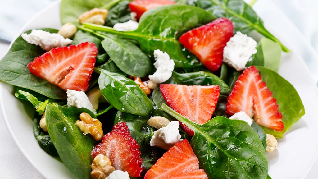 spinach salad, which can help ease menopause foot pain