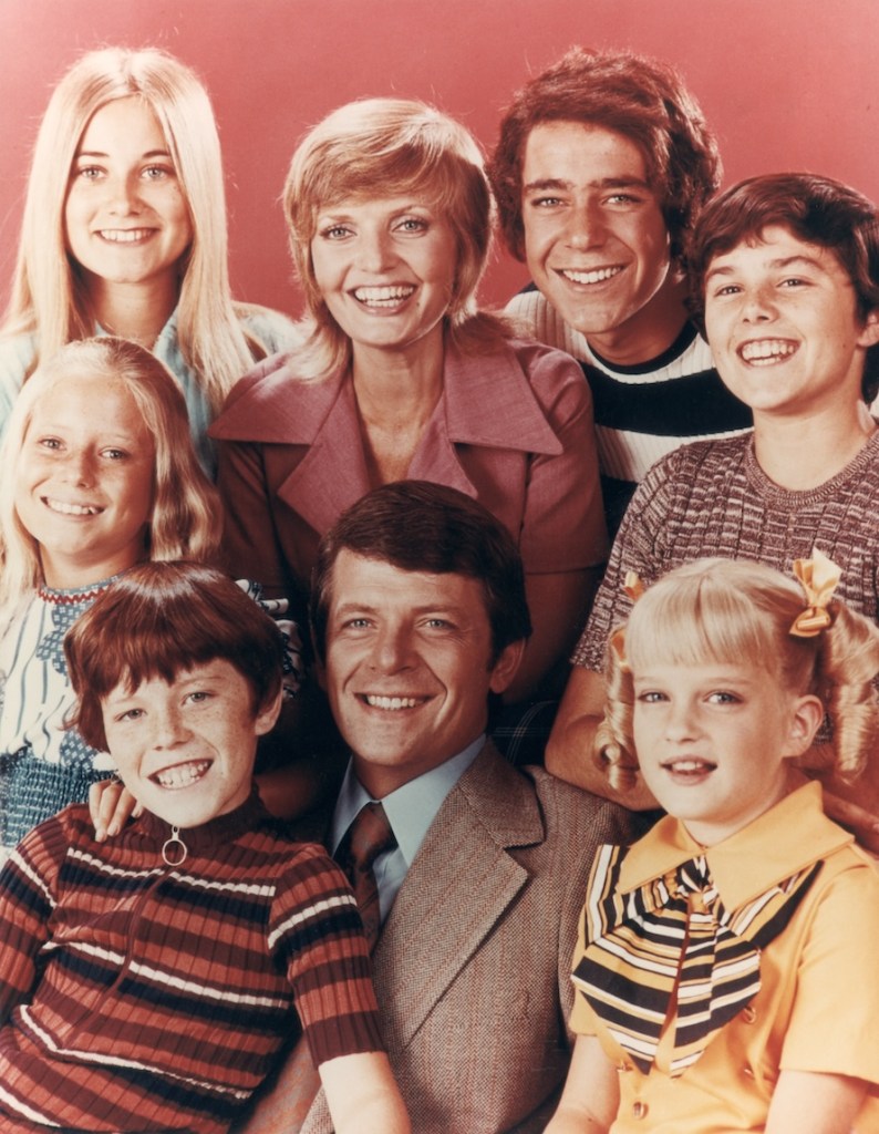 circa 1972:  The Brady family, from the television series, 'The Brady Bunch'. Top row (left to right) Maureen McCormick, Florence Henderson, Barry Williams, Christopher Knight; bottom row: Eve Plumb, Mike Lookinland, Robert Reed and Susan Olsen.  (support groups for step moms) 