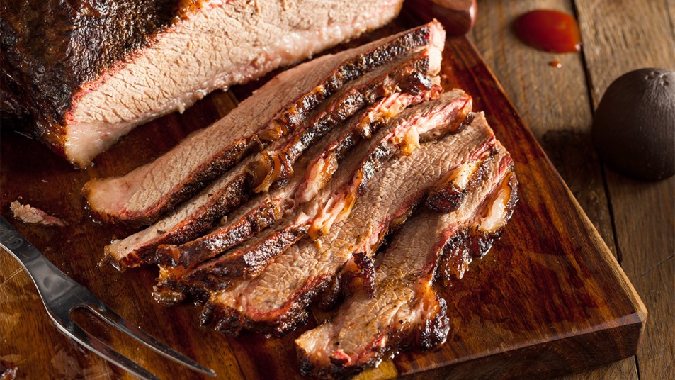 Sliced BBQ brisket as part of a guide on how to reheat the meat