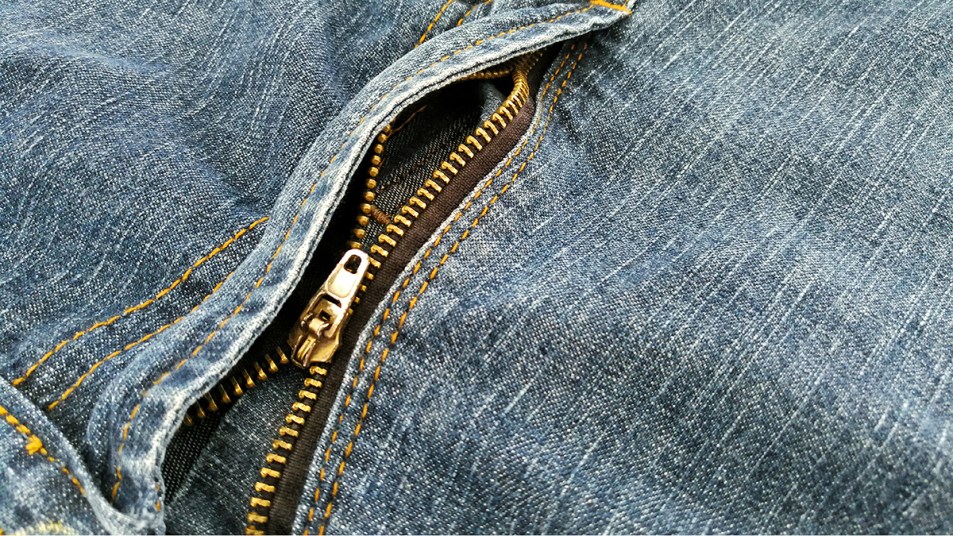A broken zipper on a pair of jeans