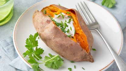 A cooked whole sweet potato as part of a guide on how to microwave sweet potatoes