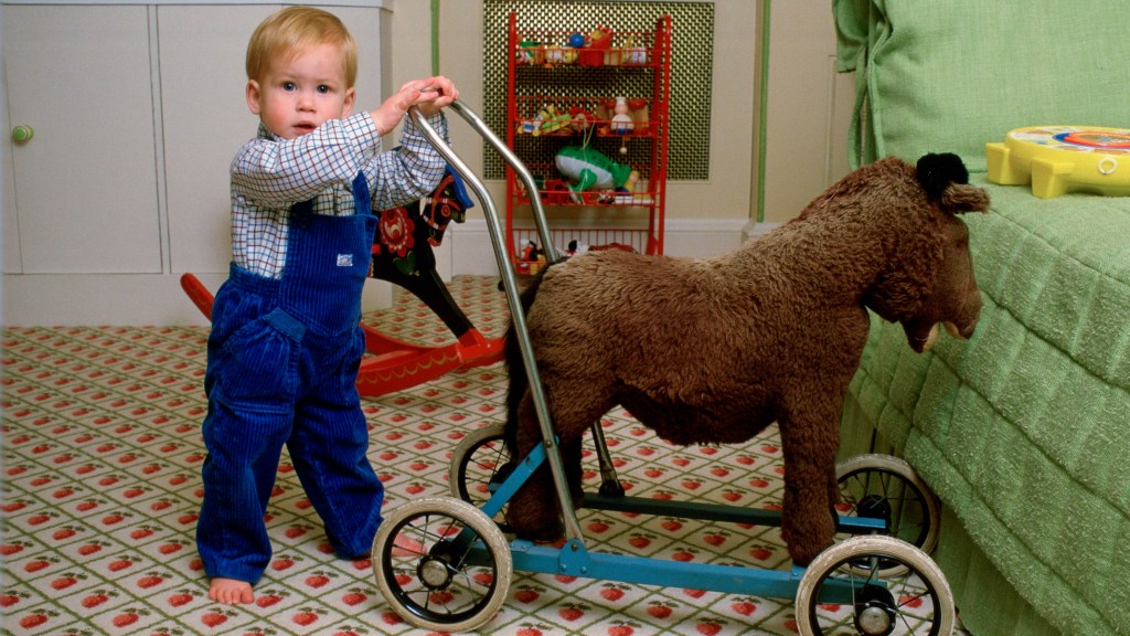 Toddler Prince Harry with a toy horse