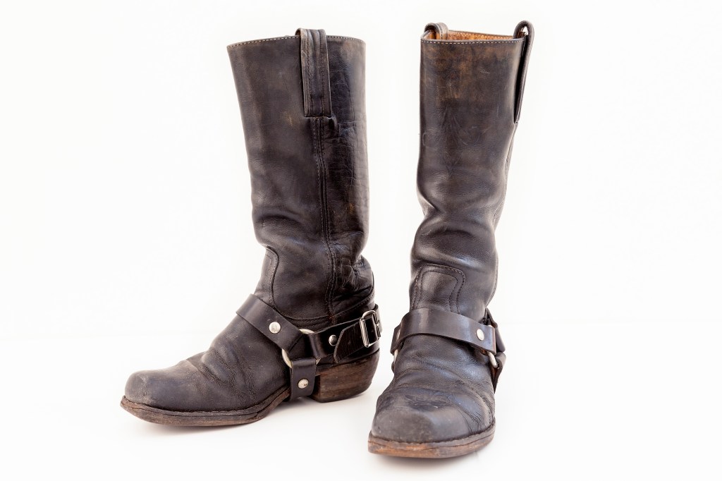 Close-Up Of Leather Boots Against White Background