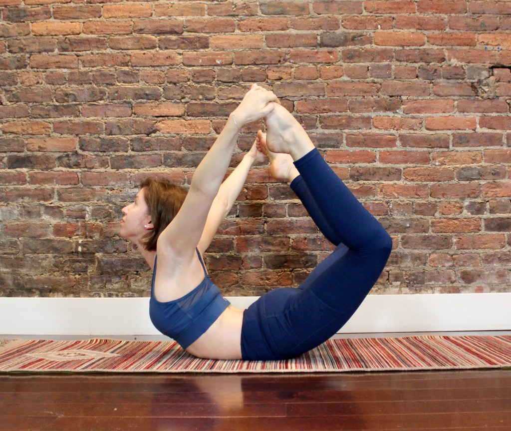 woman in bow pose