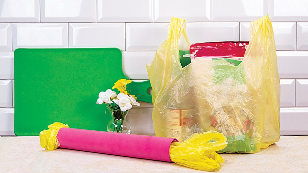 cardboard tube filled with plastic shopping bags: genius uses for cardboard tubes