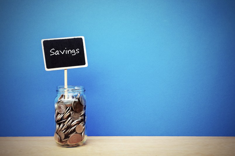 jar of coins with savings sign