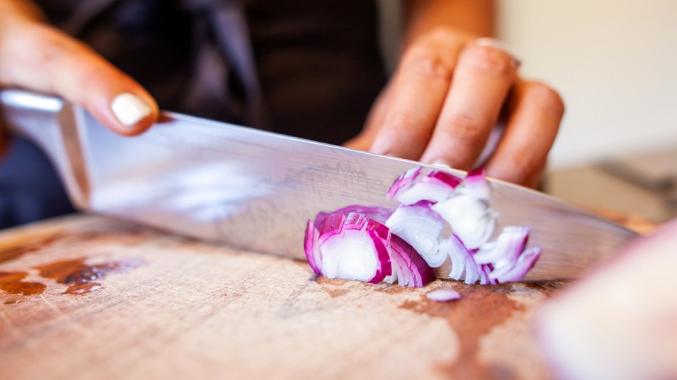 Woman cutting an onion