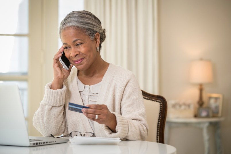 Older African American woman shopping online