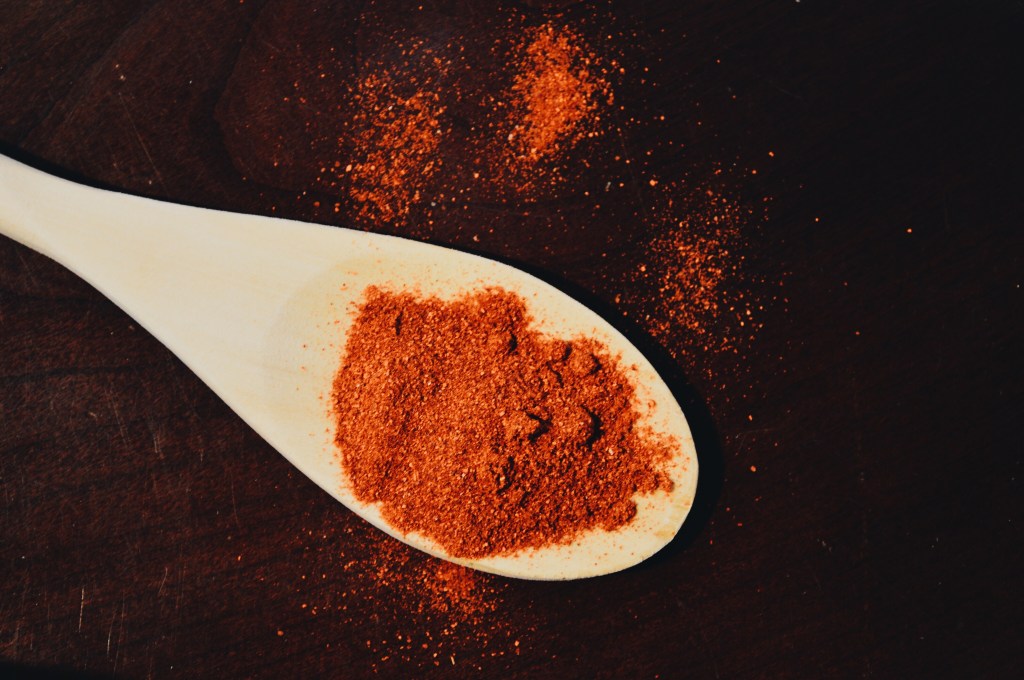 Cayenne spice on a wooden spoon