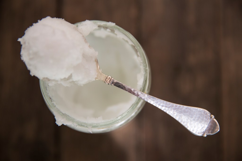 Jar of coconut oil with spoon