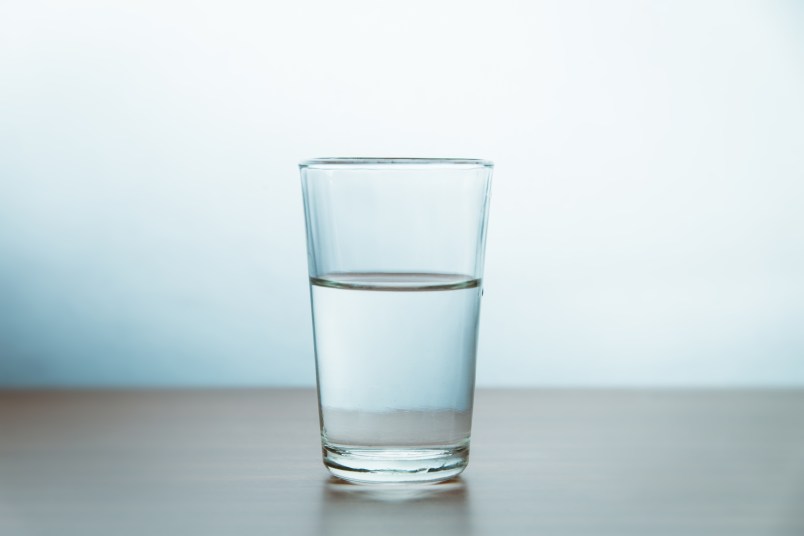 Glass Of Water On Table Against Wall