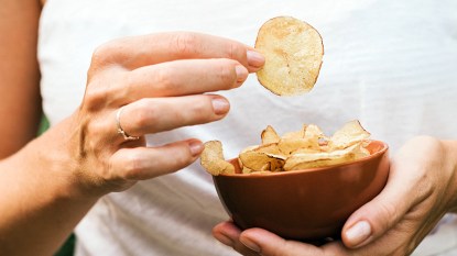 Woman holding a potato chip