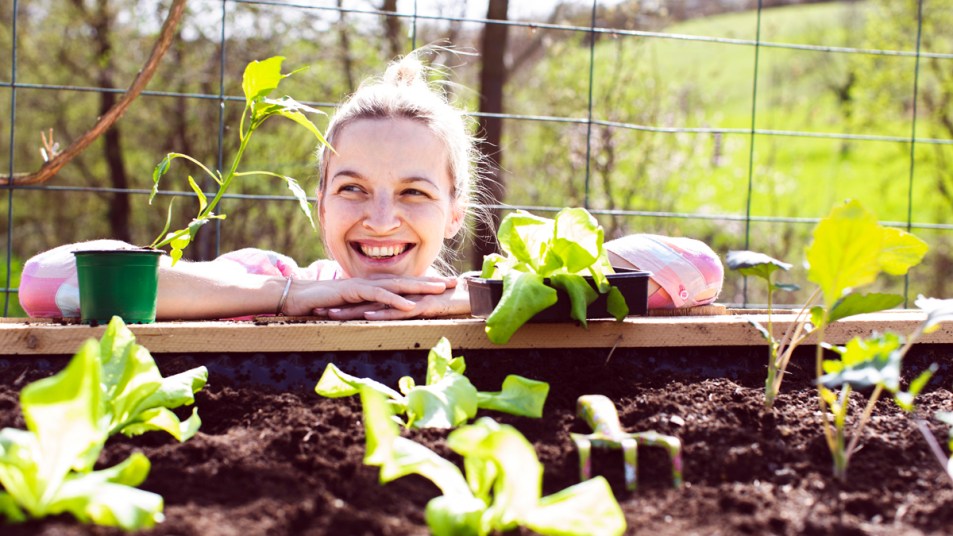 Woman smiling with plants