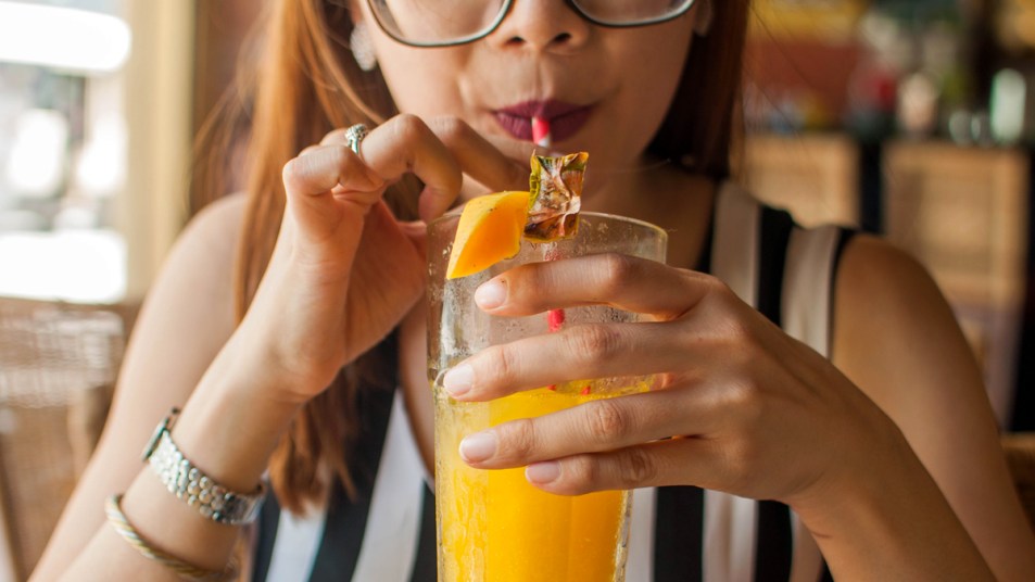Woman drinking citrus drink