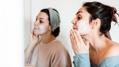 Women applying face masks