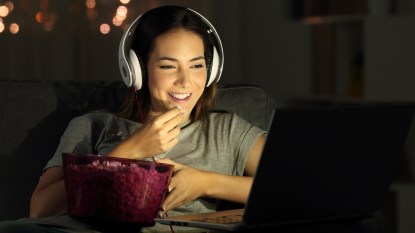 Woman watching movie on laptop
