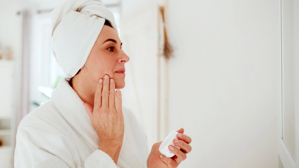 Woman using face cream