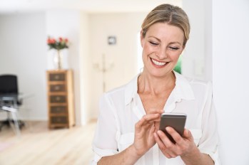 woman using wellness apps to feel better