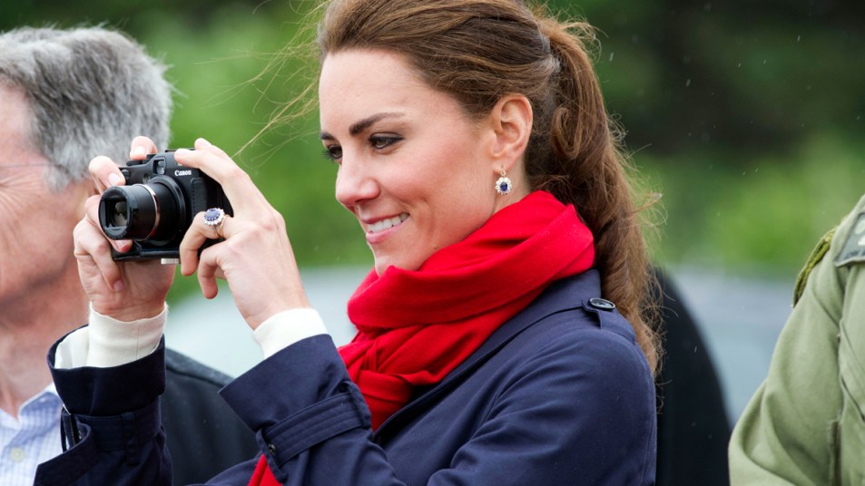 Kate Middleton holding a camera