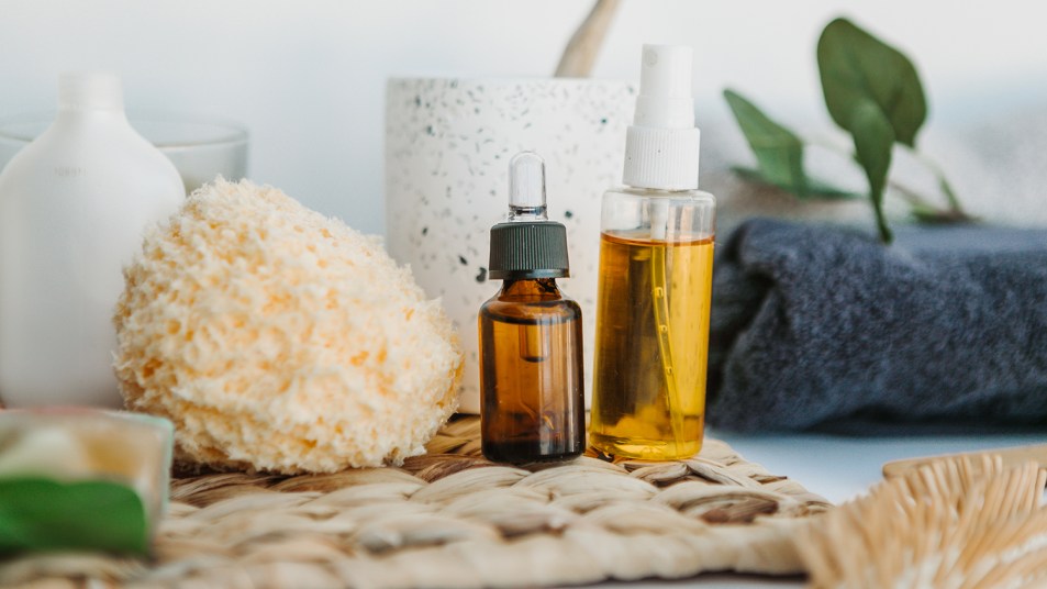 essential oils and sponge in a bathroom