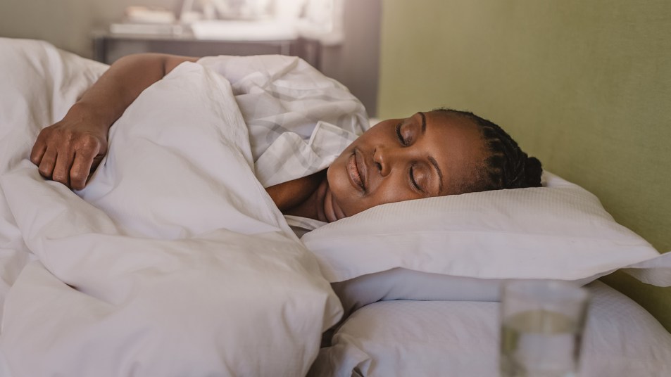 African American woman fast asleep in her bed