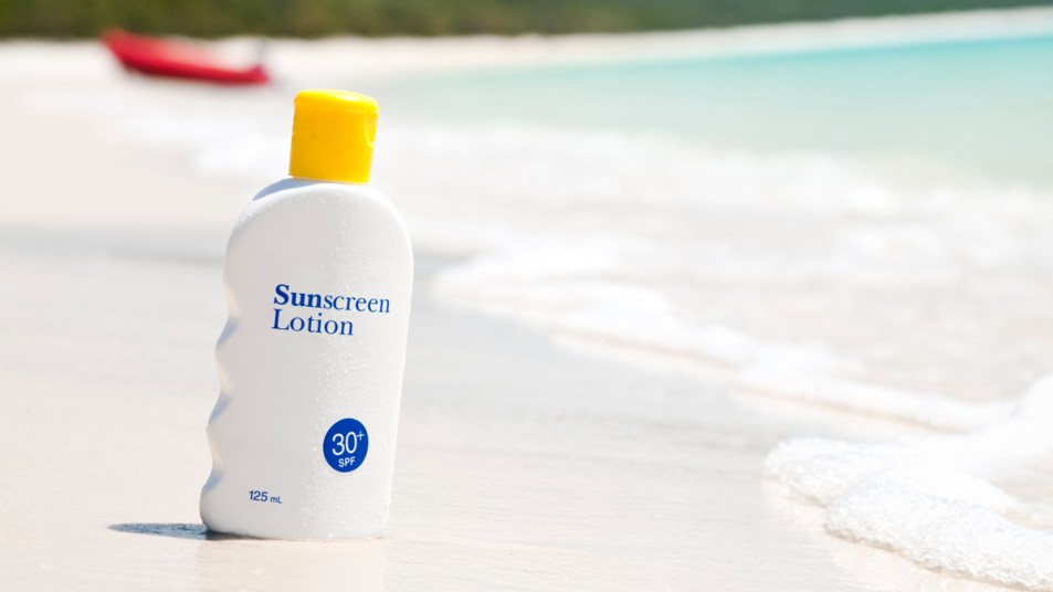Sunscreen in the sand at a beach