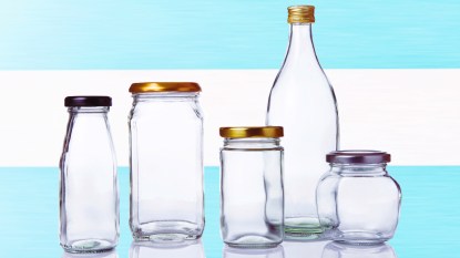 Clear jars of various sizes with blue stripe background
