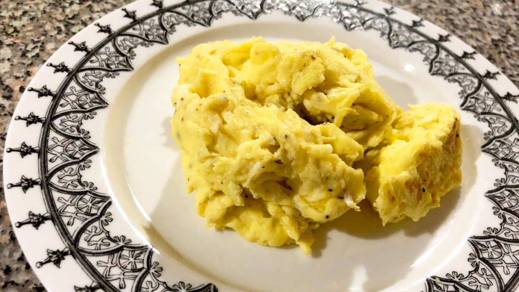 Fluffy scrambled eggs on a plate