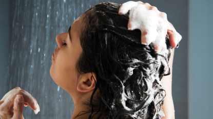 Woman with brown hair in shower