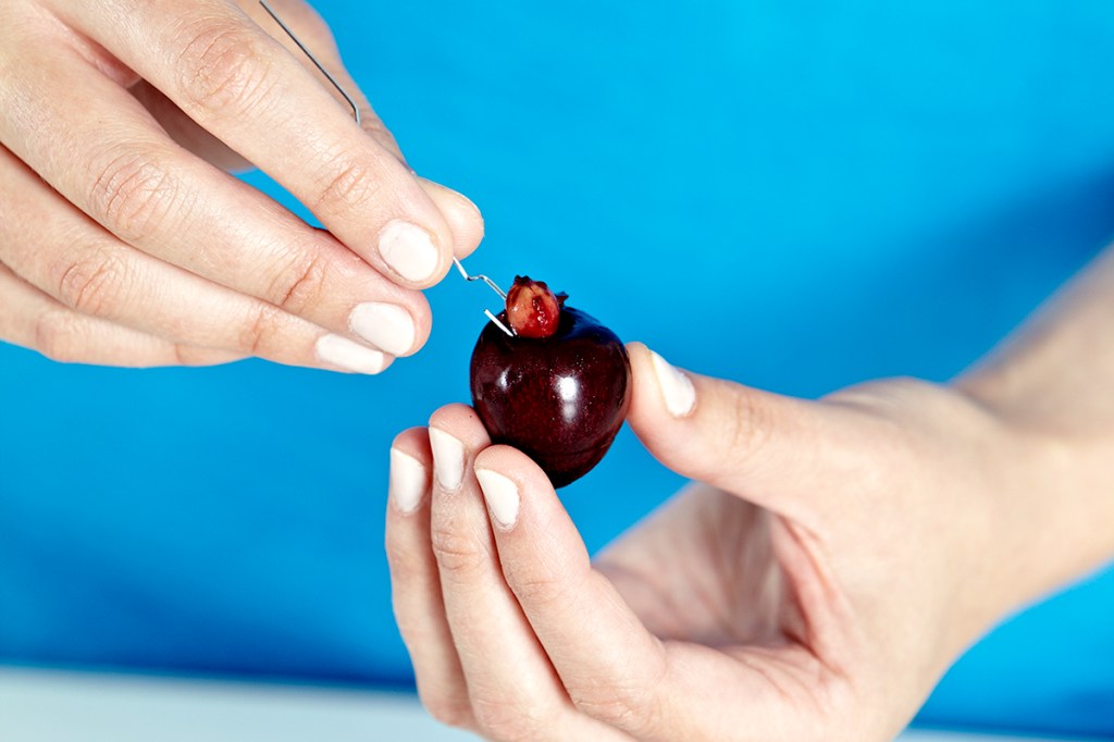 Removing pits from cherries is a brilliant use for paper clips