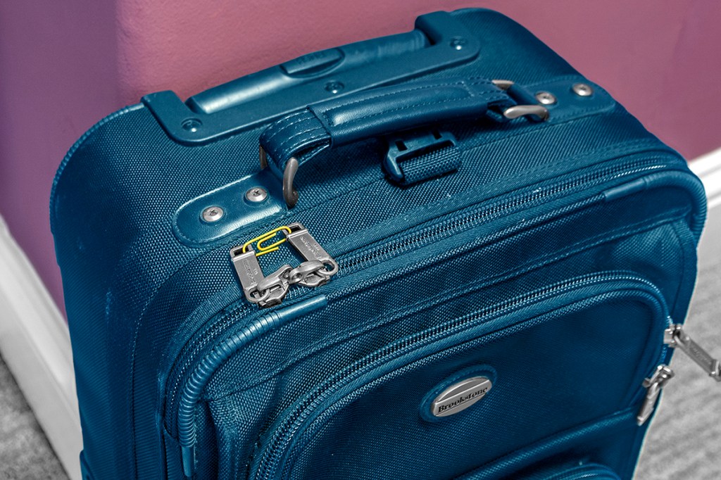 Keeping a suitcase closed is a brilliant use for paper clips