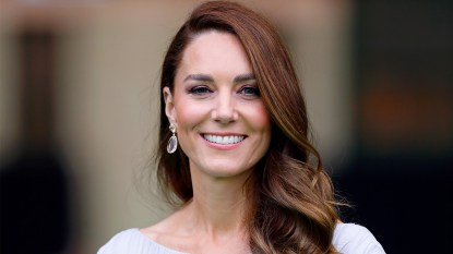 Kate Middleton smiling with her hair curled