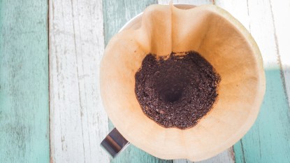 An overhead shot of used coffee grounds which have many uses