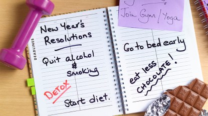 journal with goals listed; how to keep new year's resolutions