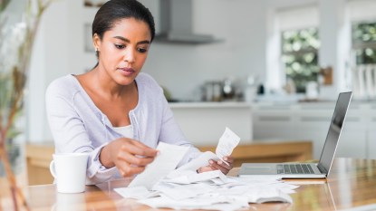 Woman Sorting Paper Receipts