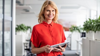 Older woman smiling in an office