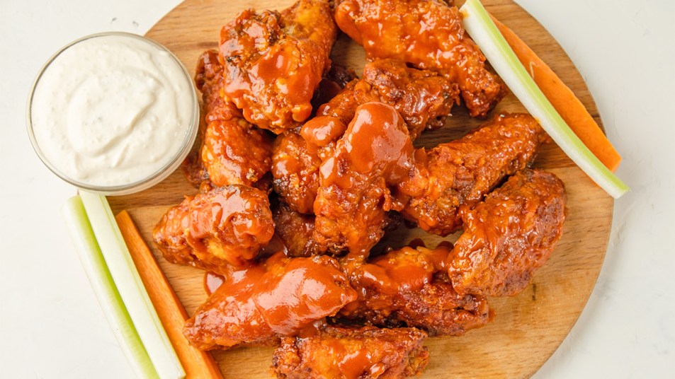 A serving of Buffalo wings as part of a guide on reheating them in the oven