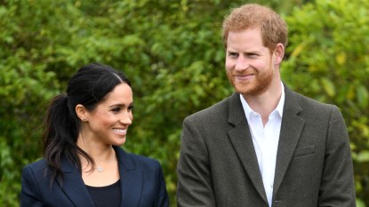 Harry and Meghan both smiling