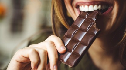 Woman's mouth eating chocolate