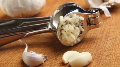 Garlic Press and garlic cloves