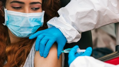 Woman getting drive-thru covid vaccin