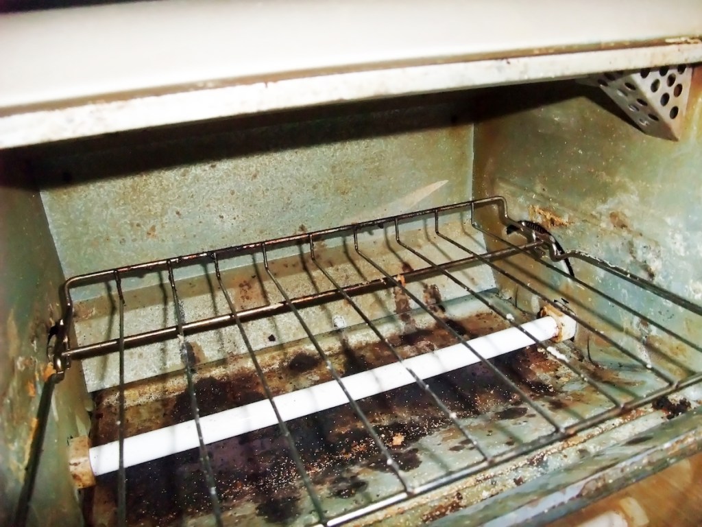 Inside of dirty toaster oven