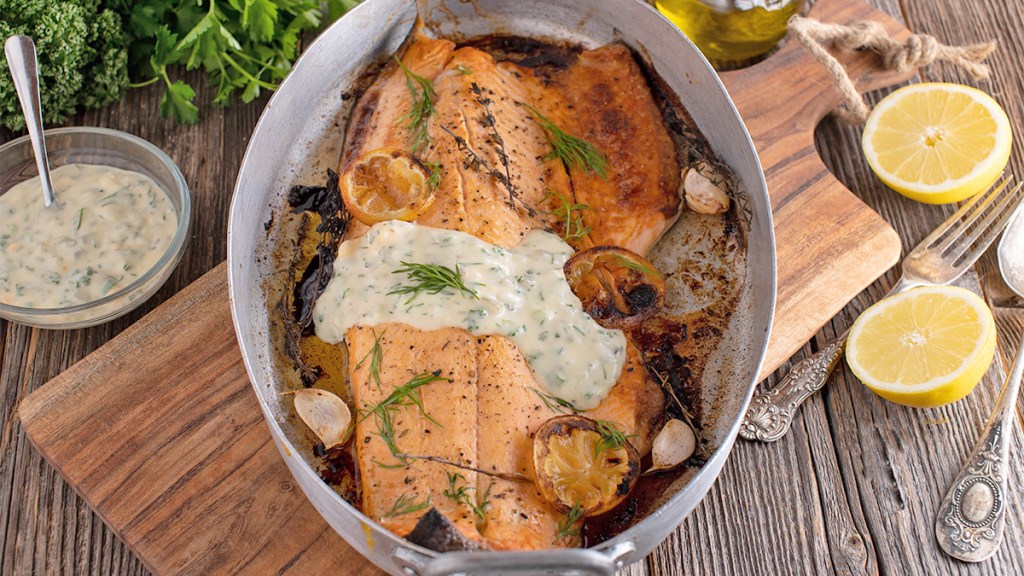 Roasted salmon fillet with tzatziki as part of a guide on how to reheat the fish