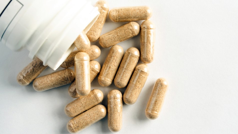 Beige supplement capsules