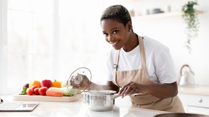 Woman preparing dinner early to reap the benefits
