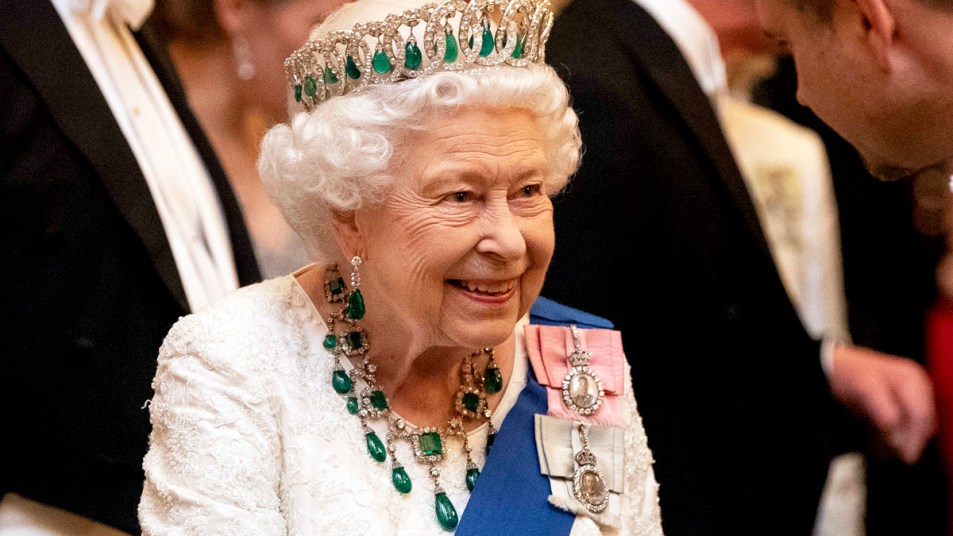 Queen Elizabeth wearing emerald and diamond tiara, earrings, and necklace