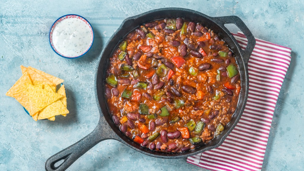 A bowl of chili con carne filled with beans and veggies